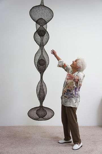 Ruth Asawa with one of her signature hanging sculpture